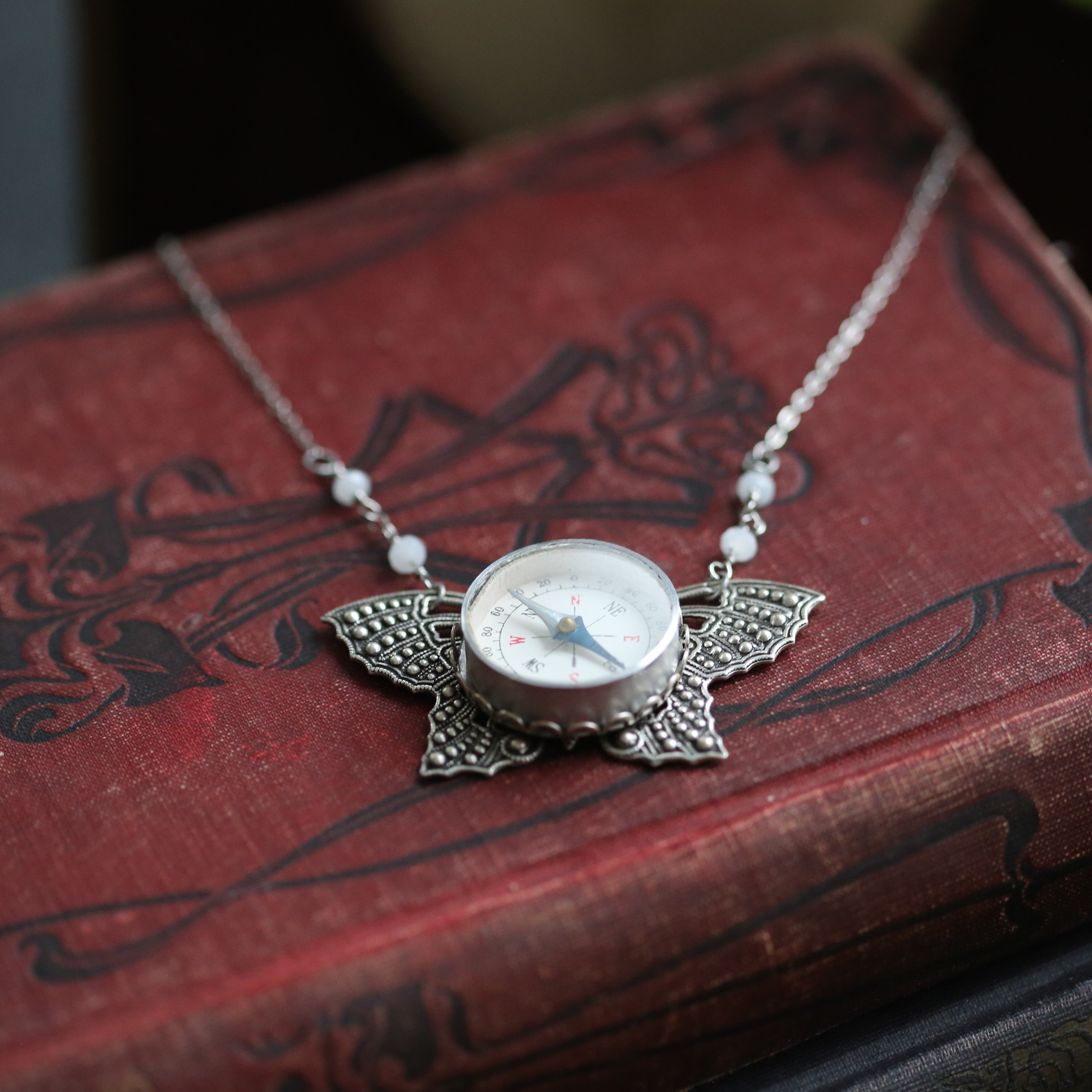 Butterfly Filigree Compass Short Necklace in Antique Silver with Translucent White Beads