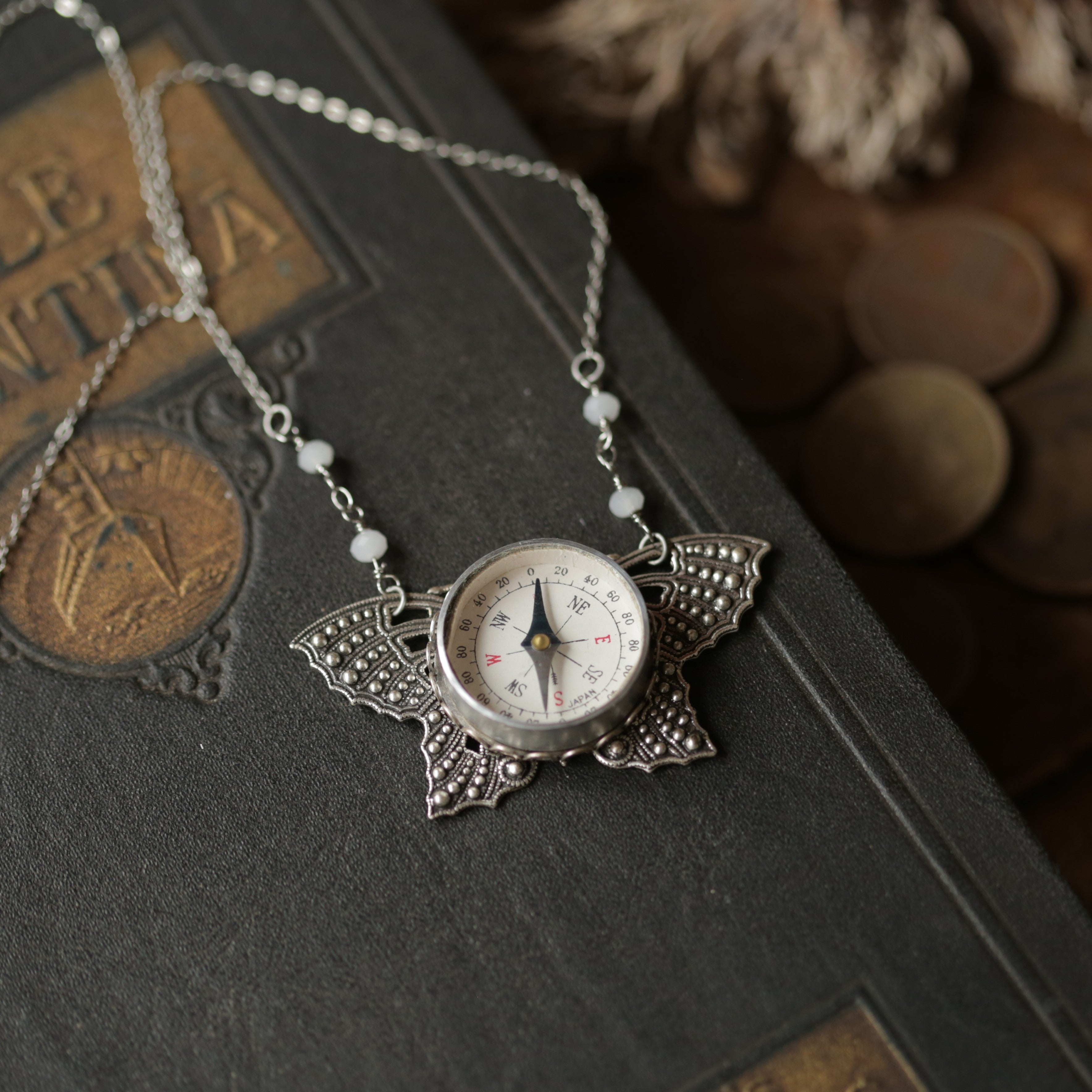Butterfly Filigree Compass Short Necklace in Antique Silver with Translucent White Beads