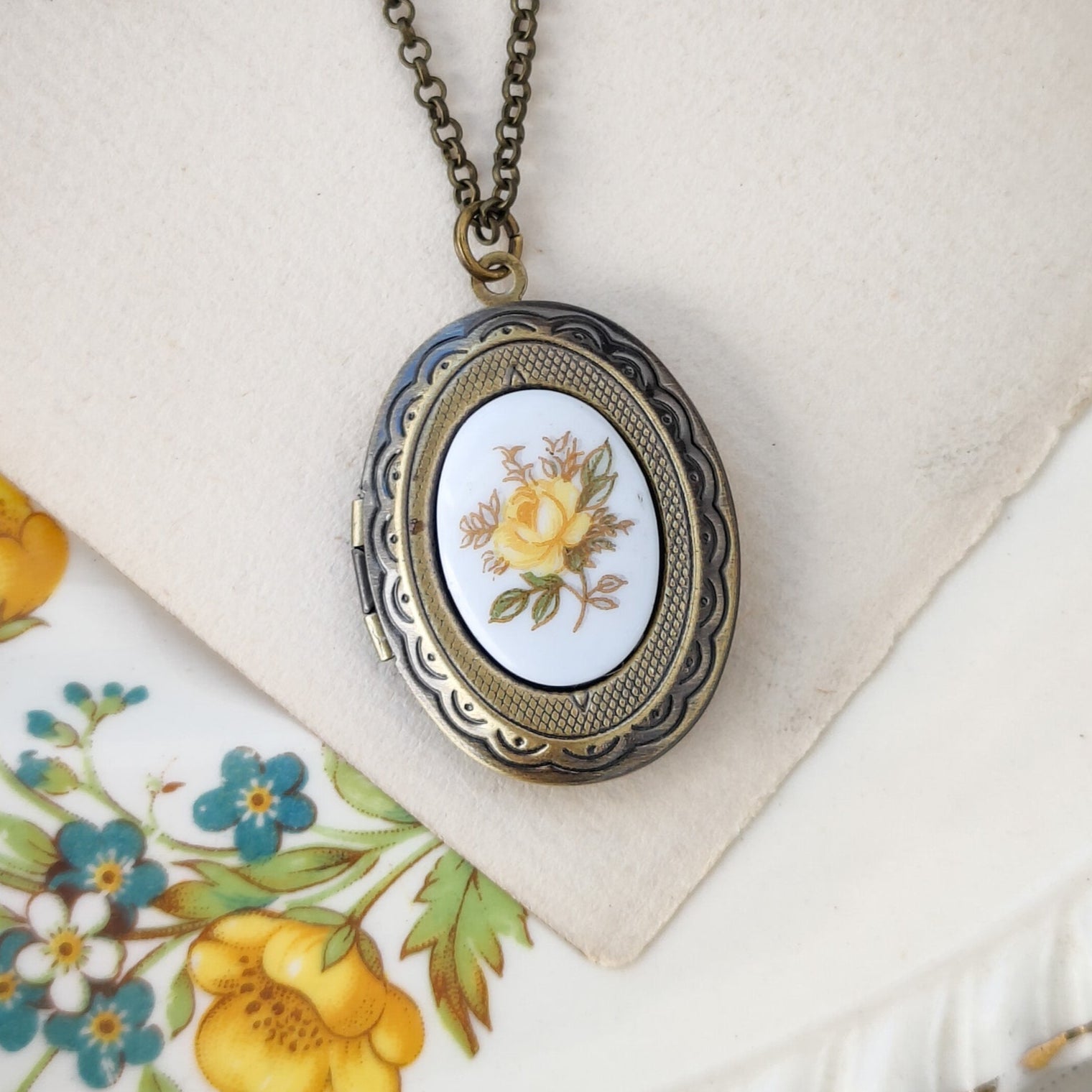 Antiqued brass vintage style locket necklace with antique porcelain yellow rose cameo