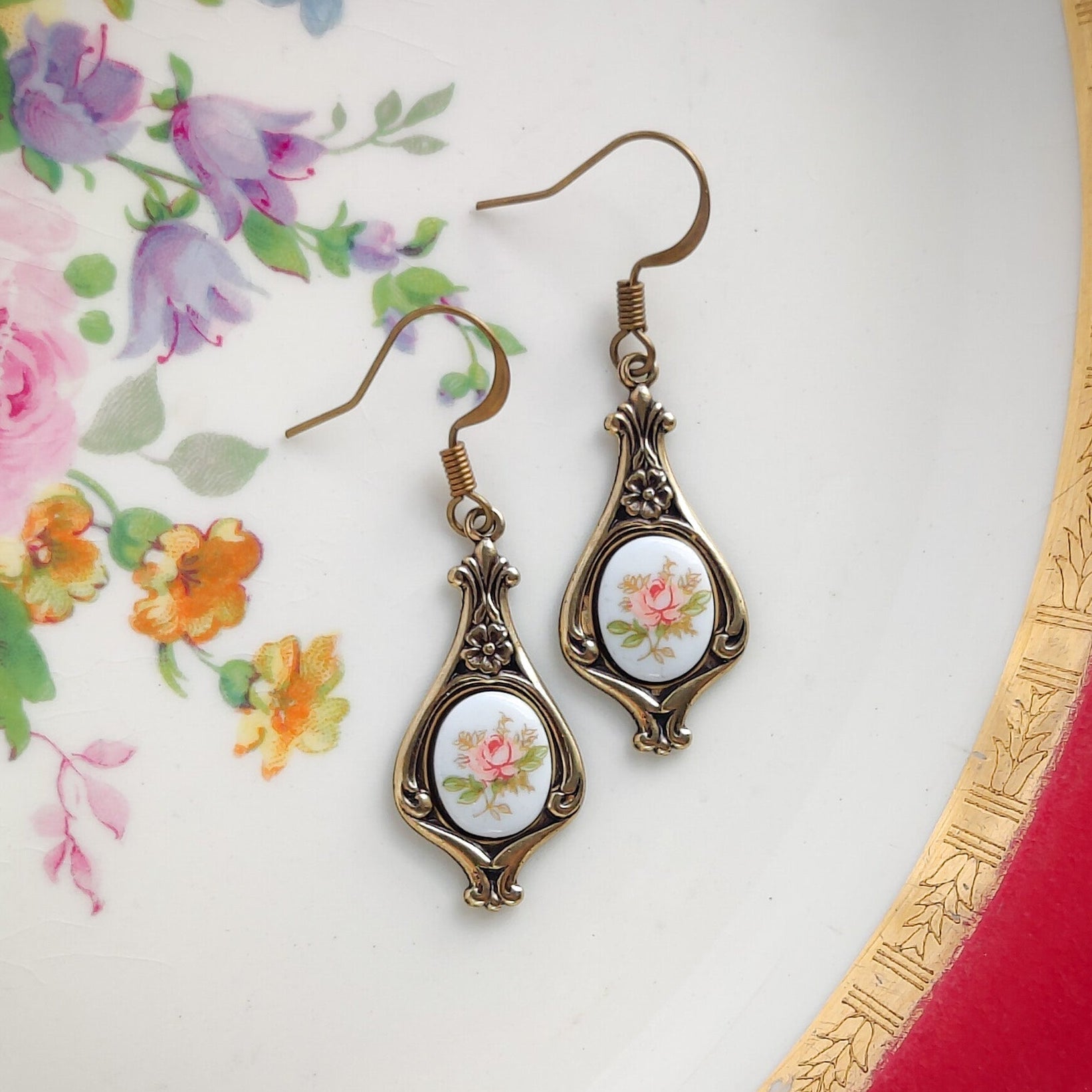 Antiqued brass retro style tear drop earrings with vintage pink rose porcelain cameos