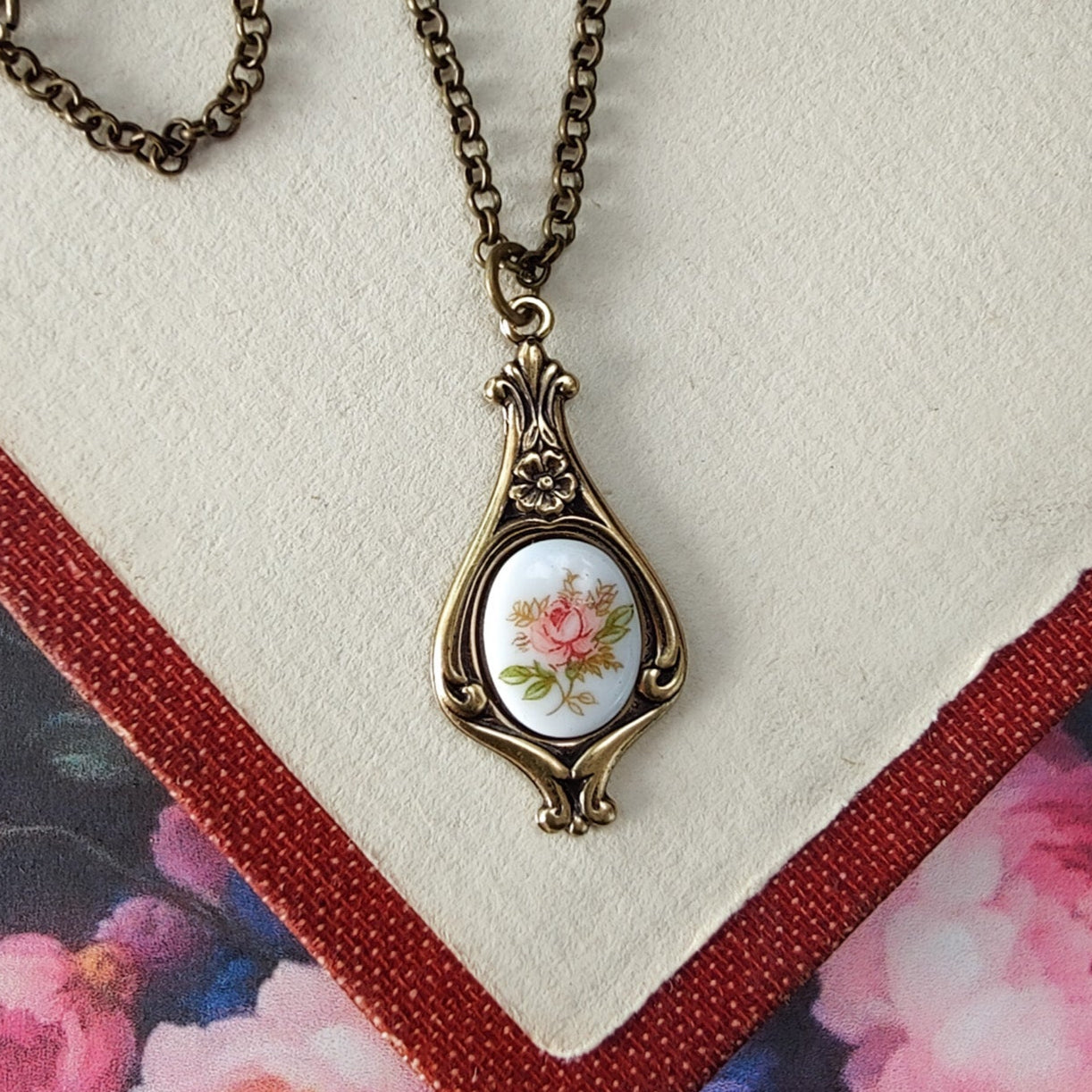 Antiqued retro-style drop necklace with vintage porcelain rose cameo