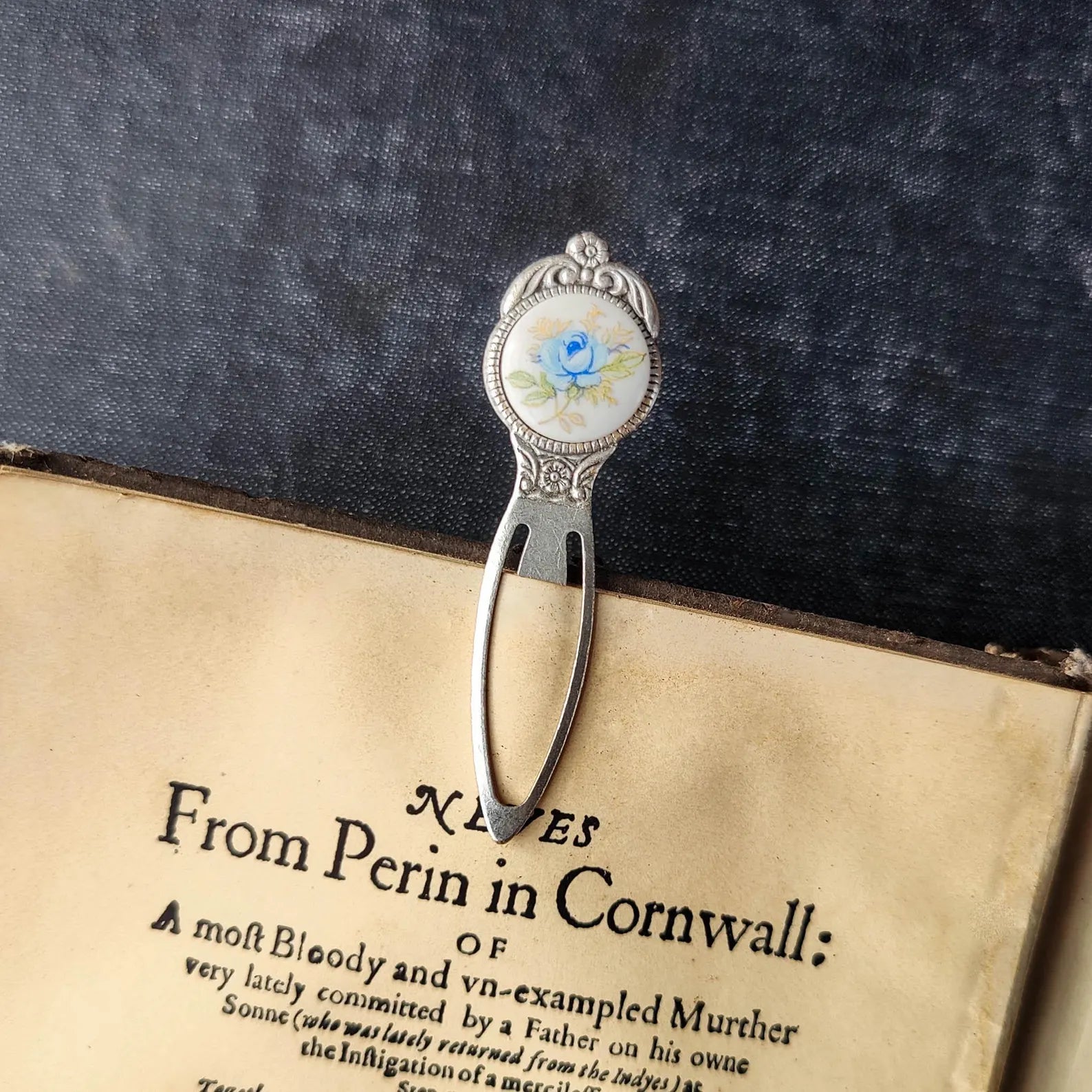 antiqued silver modern vintage inspired blue rose cabochon circle bookmark. Great gift for writers.