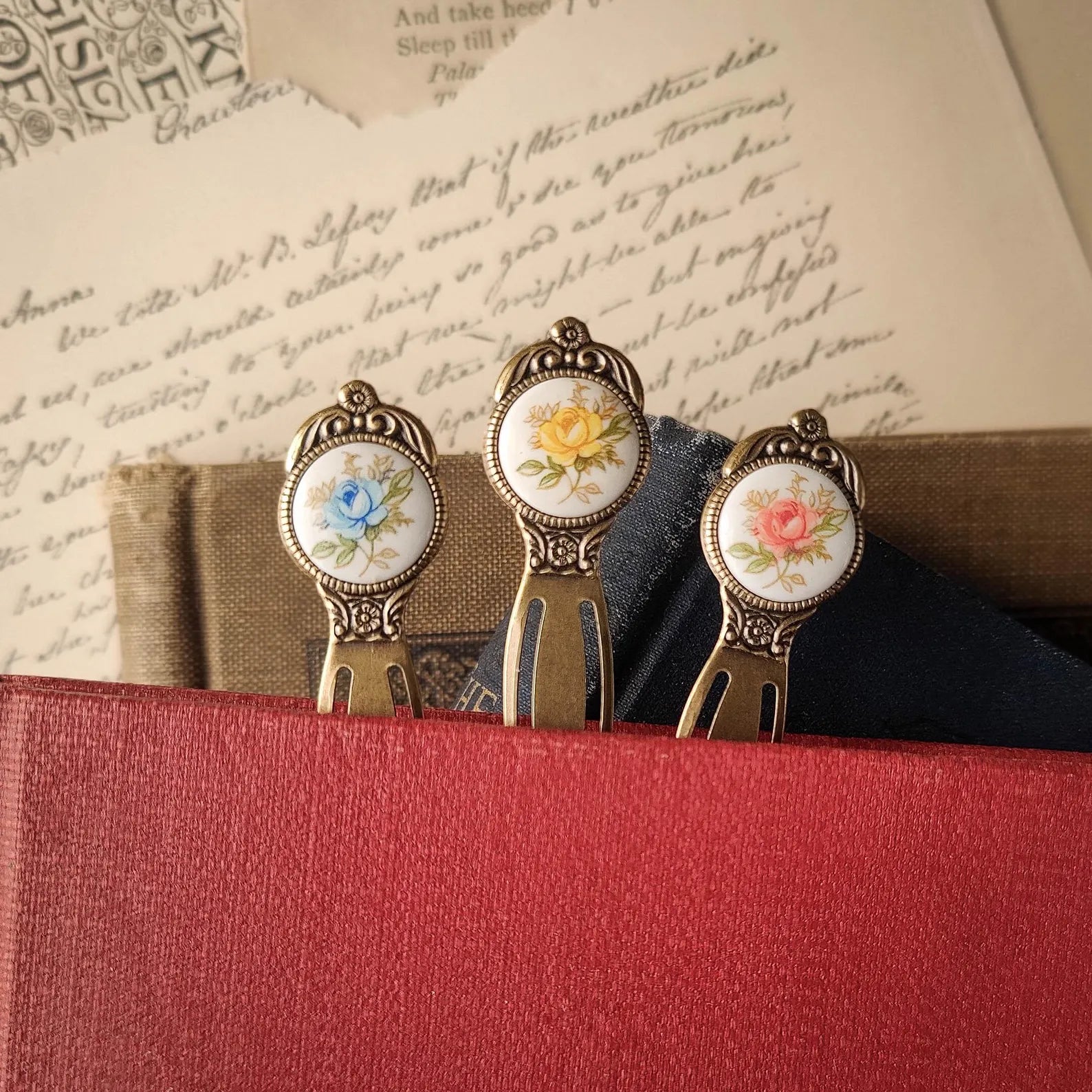 antiqued brass modern vintage inspired pink yellow or blue rose cabochon circle bookmark. Great gift for tutors.