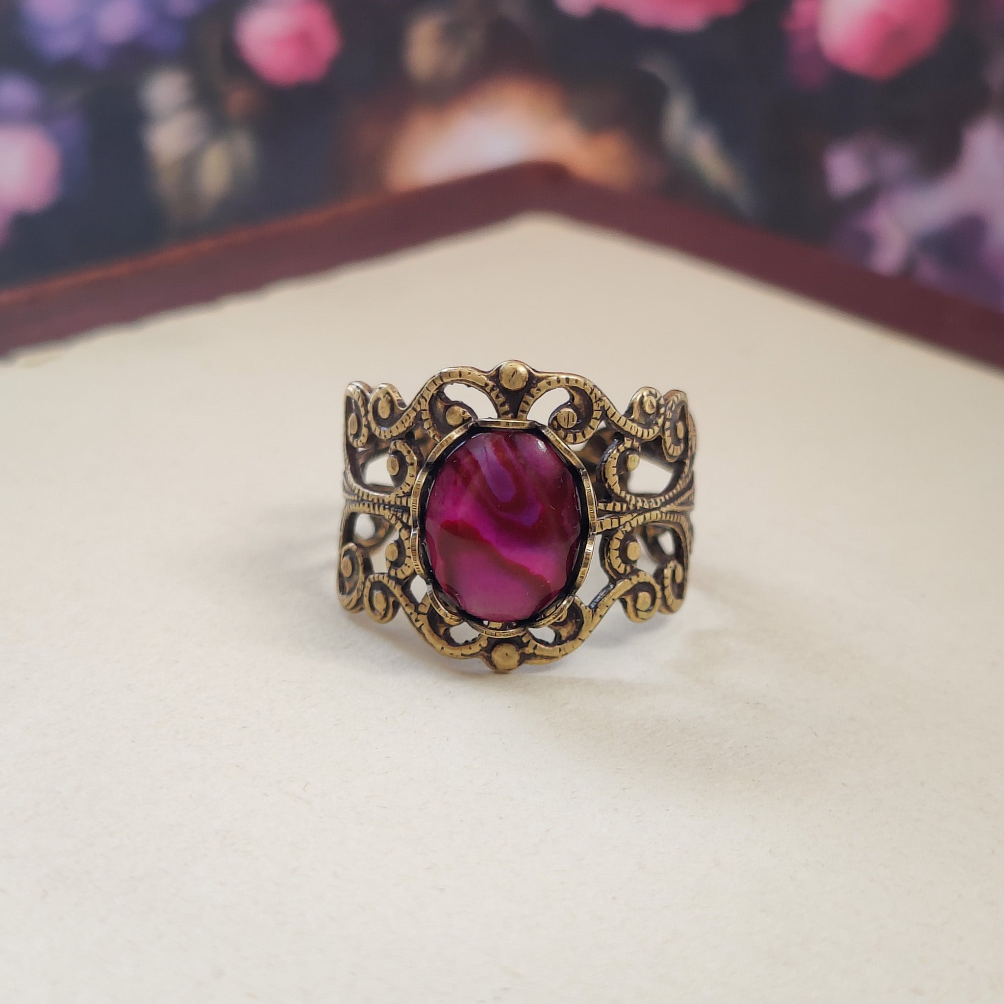 antiqued brass modern vintage inspired resizable statement filigree ring with a rich rose pink paua oval shell in the pink soft girl aesthetic