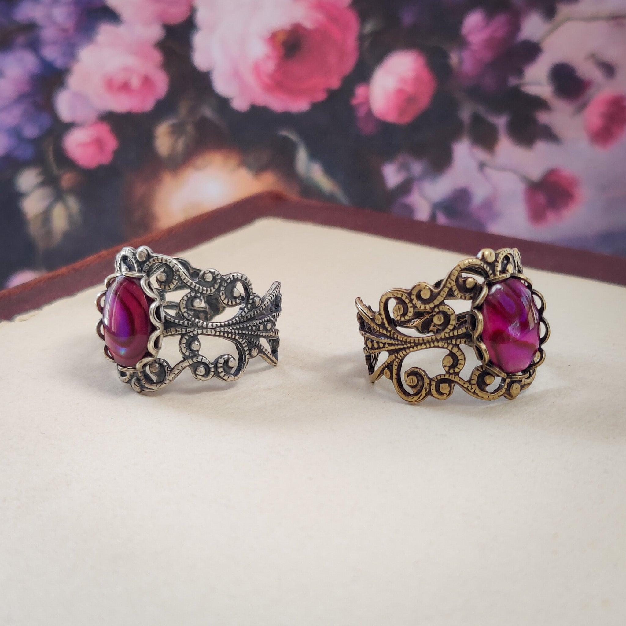 antiqued silver modern vintage inspired adjustable statement filigree ring with a rich rose pink paua oval shell in the pink punk rock princess aesthetic