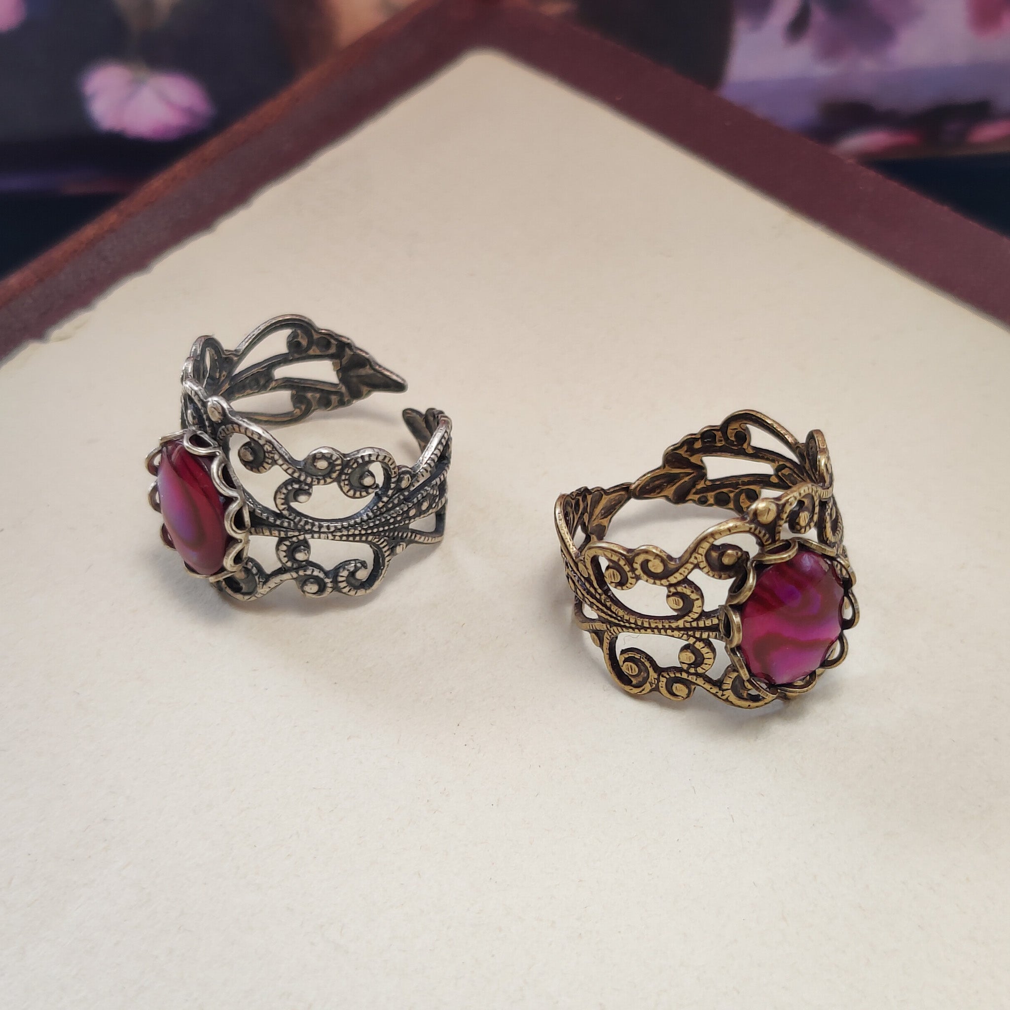 antiqued silver modern vintage inspired adjustable statement filigree ring with a rich rose pink paua oval shell in the pink fairycore aesthetic