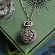 antiuqed brass wearable pocket watch necklace with dragonfly. Battery operated.