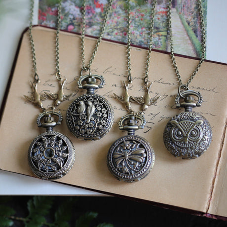 Antiqued brass vintage style working pocket watch necklace with birds butterflies dragonflies or owls.