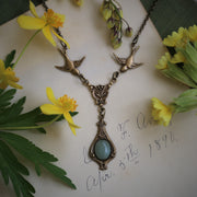 Antiuqed brass victorian vintage style bird necklace with an oval aventurine stone drop by ragtrader vintage.