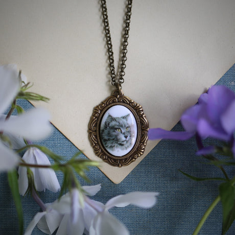 Gray long haired cat cameo on an antiqued brass necklace made in a vintage style.  Great gift for a cat owner or vet.