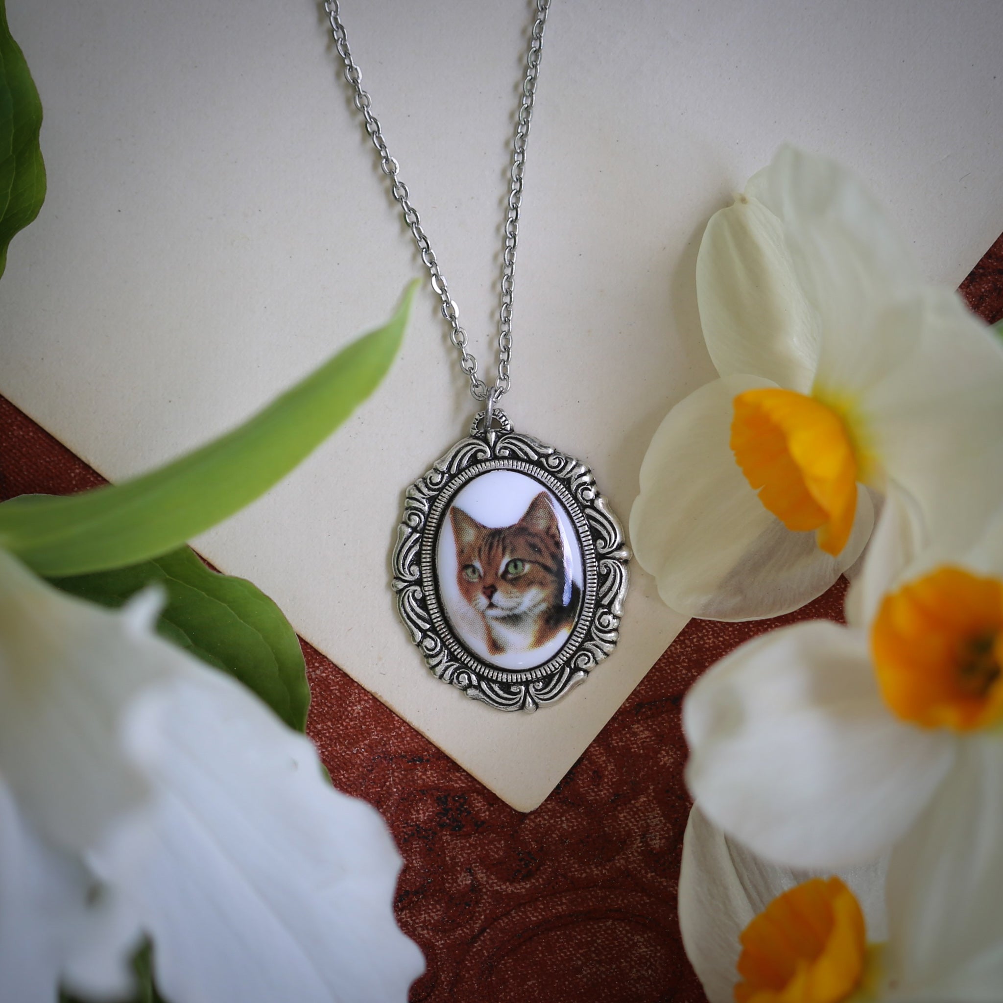 Orange short haired cat cameo set on antiqued silver vintage style necklace by ragtrader vintage.