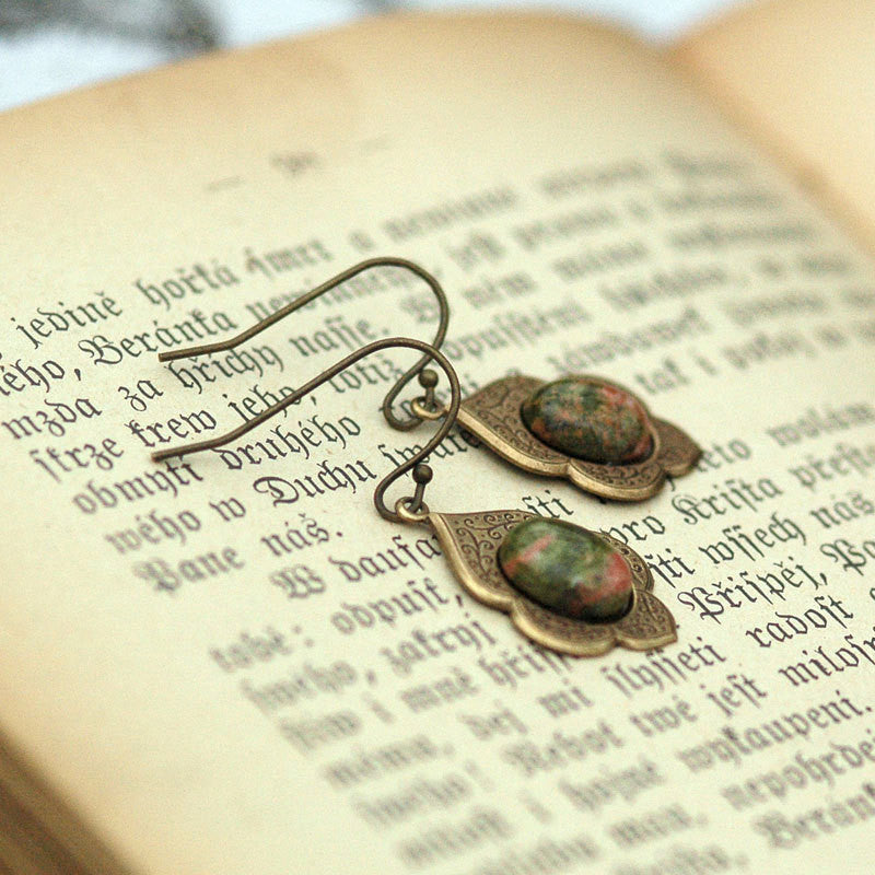 Antiqued brass earrings with unakite cabochons on deco drop settings.
