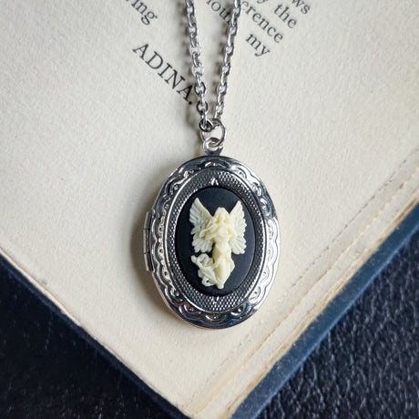 Silver locket necklace with Angel cameo in black and white.  