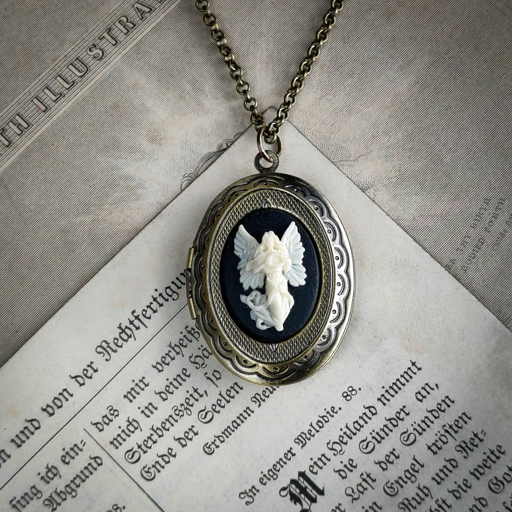 Brass locket necklace with Angel cameo in black and white.  
