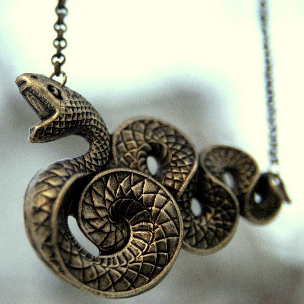 Victorian snake pendant necklace in brass.