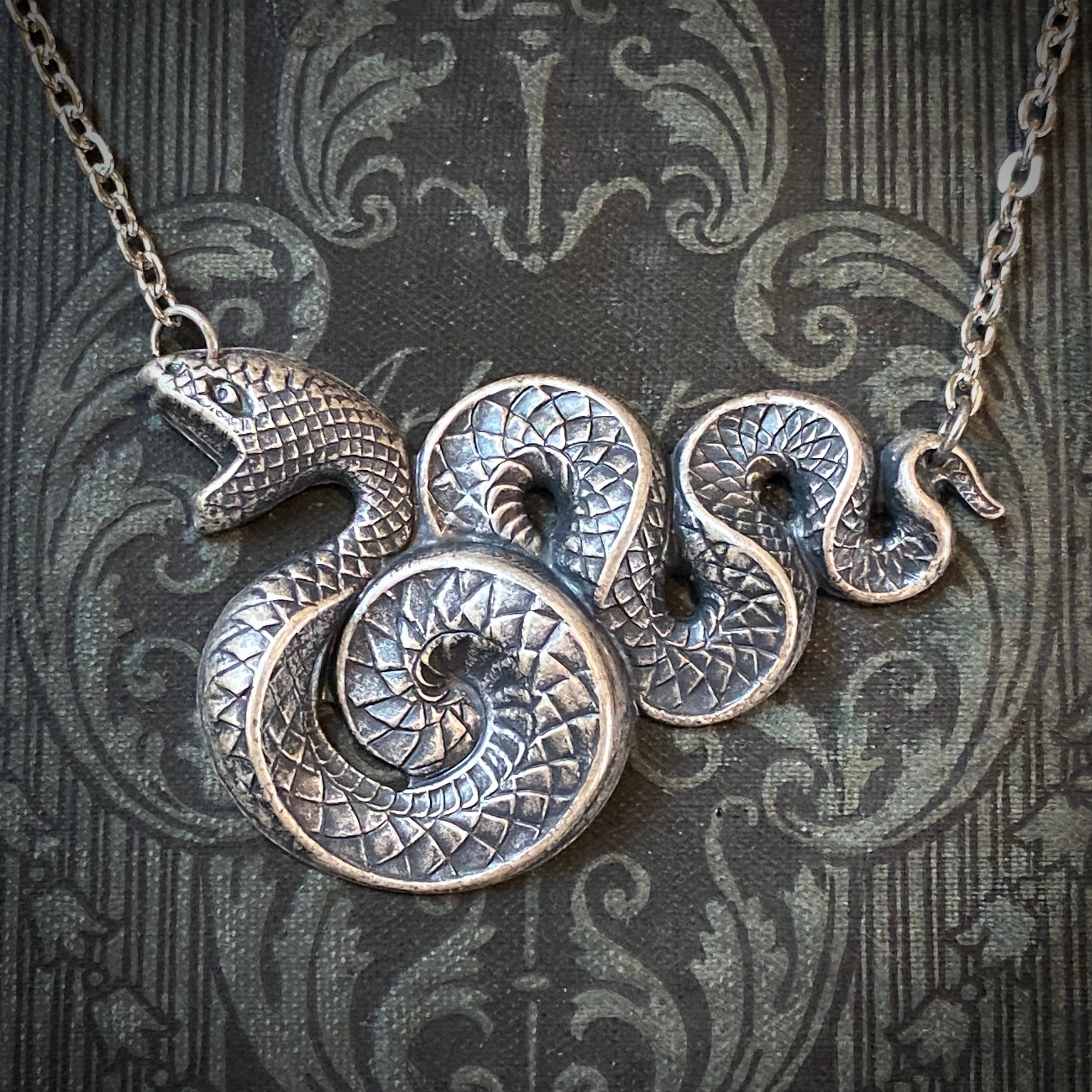 Antiqued silver Victorian snake pendant necklace.