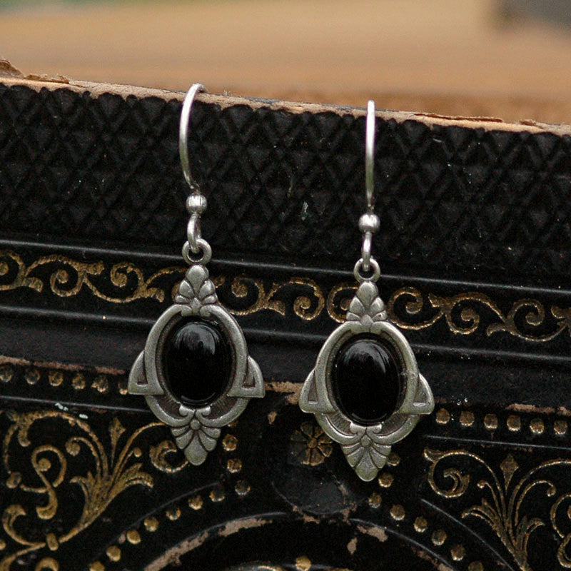 Antiqued silver vintage style art deco dangle earrings with black onyx oval stone set in the center.