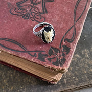 Antiqued silver retro vintage style adjustable ring with black and white angel cameo ring.