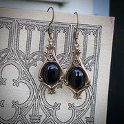 Antiqued brass vintage style stone drop black onyx oval mineral hook earrings.