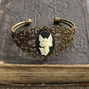 Antiqued brass bronze tone vintage style Victorian adjustable bracelet cuff with a black and white angel cameo.