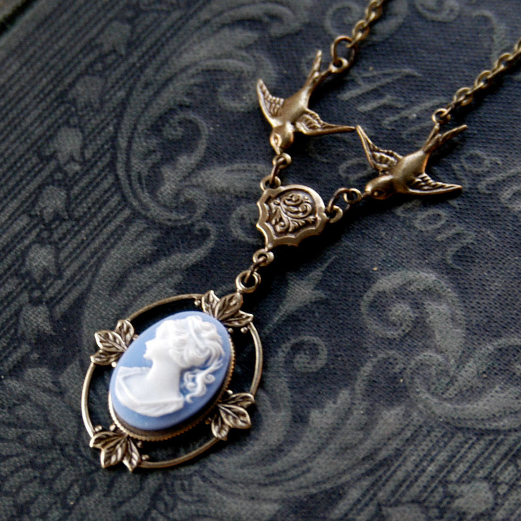 Antiqued brass Victorian lady white on blue cameo necklace on a chain with birds.