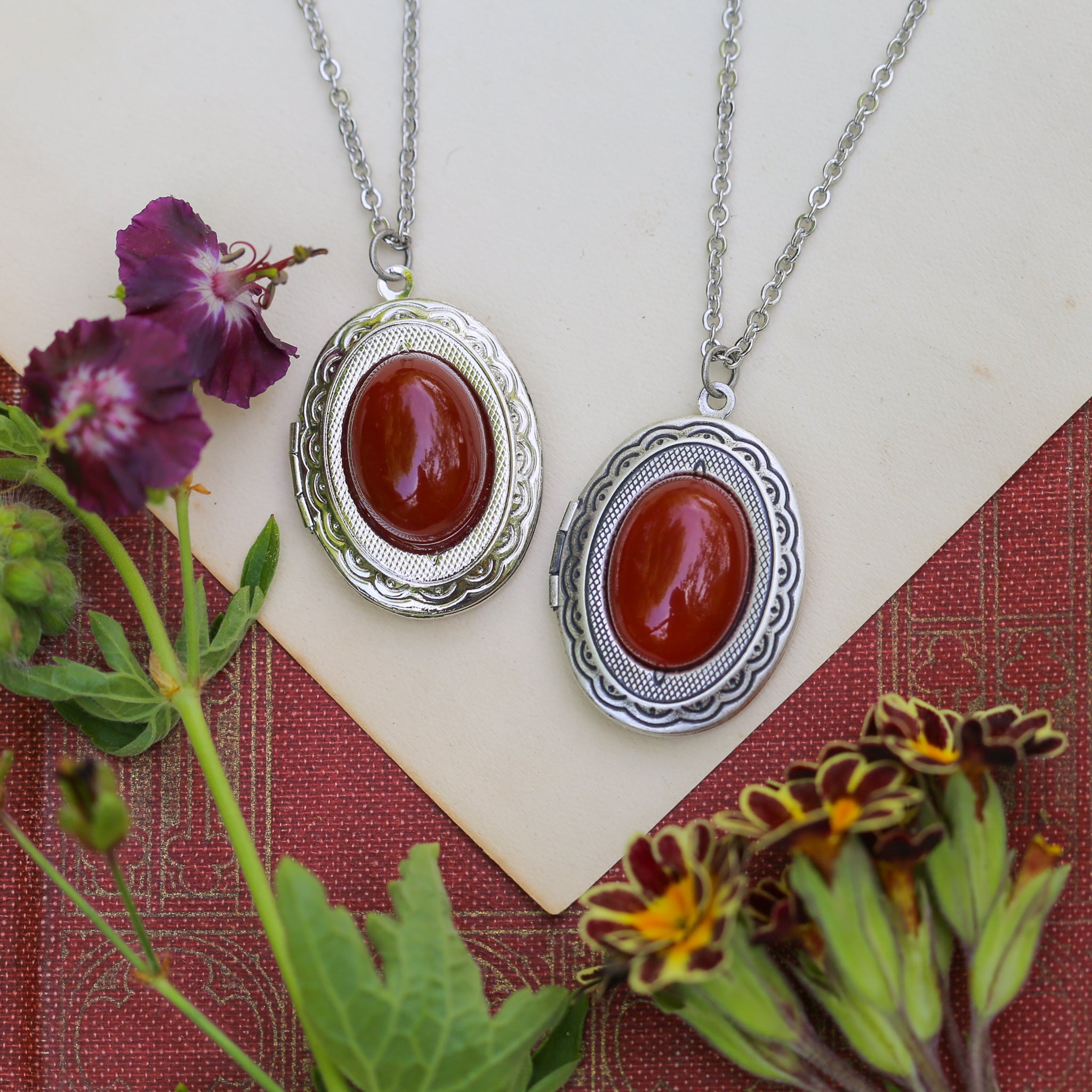 Antiqued silver bohemian vintage-style long oval orange carnelian semi-precious stone mineral locket in vibrant fall blood red style great sentimental gift for loved one.