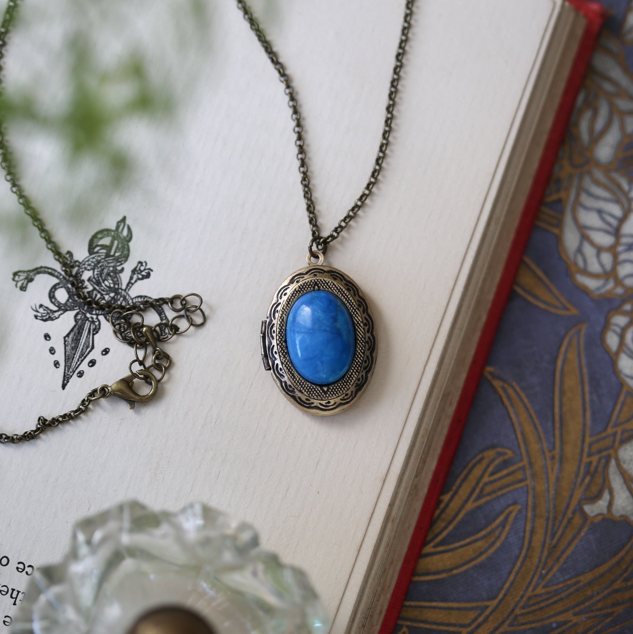 antiqued brass vintage style blue howlite semi-precious mineral oval stone lockets in dark nautical style