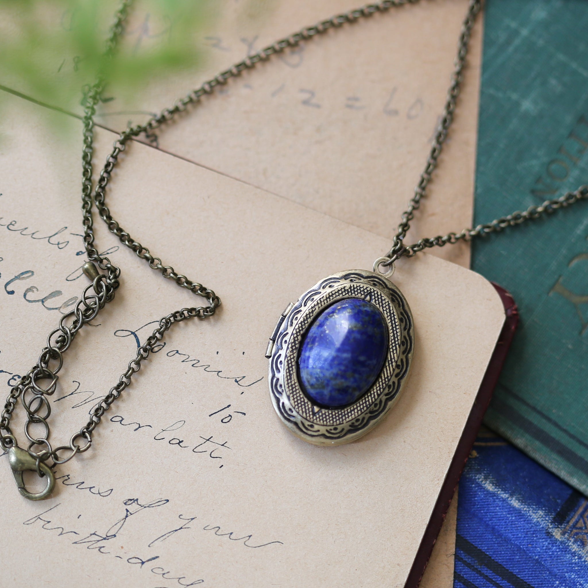 antiqued brass vintage style blue lapis lazuli semi-precious mineral oval stone lockets in zen fashion style