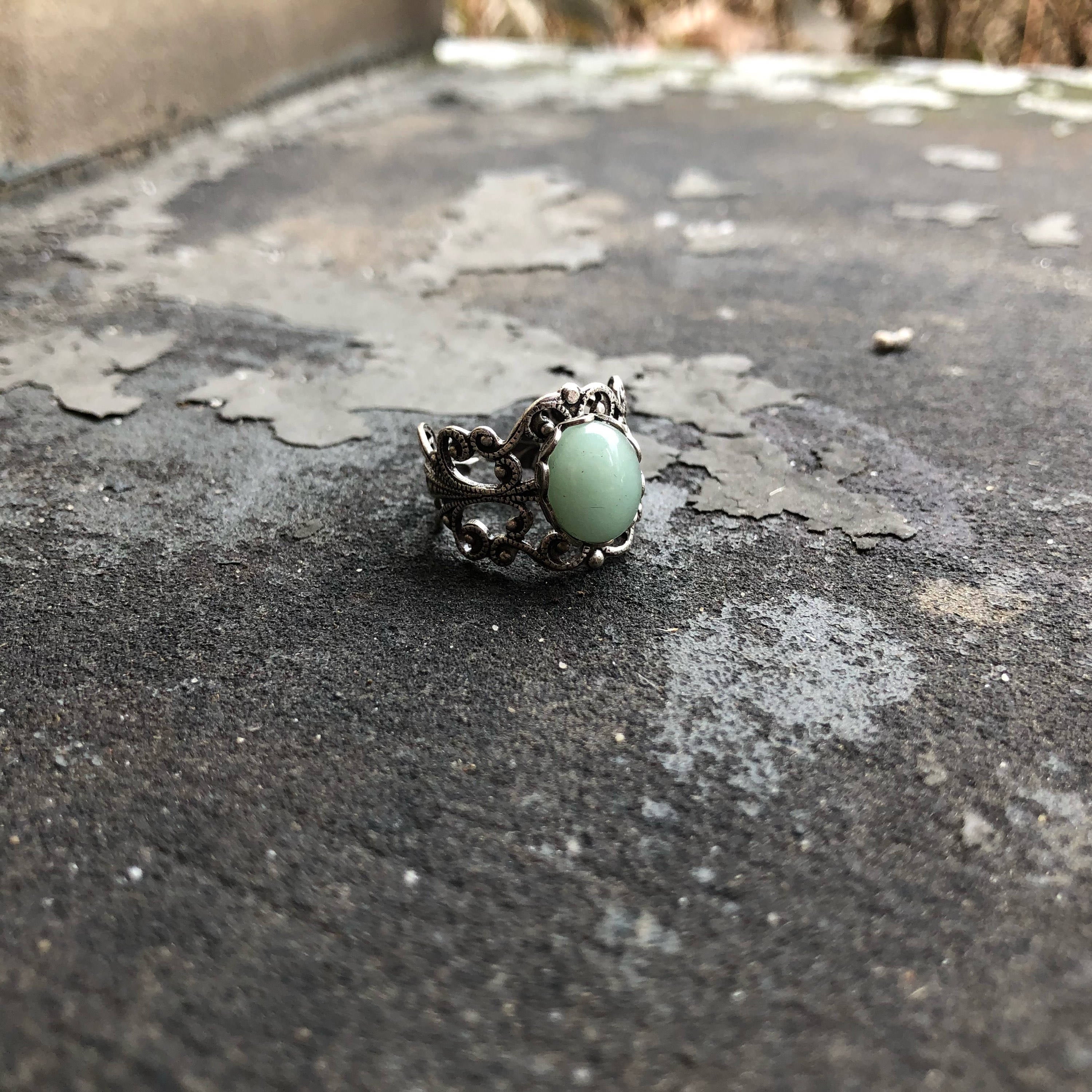 Antiqued silver modern vintage inspired adjustable filigree cocktail ring with a green aventurine semi-precious stone in the bloomcore style.