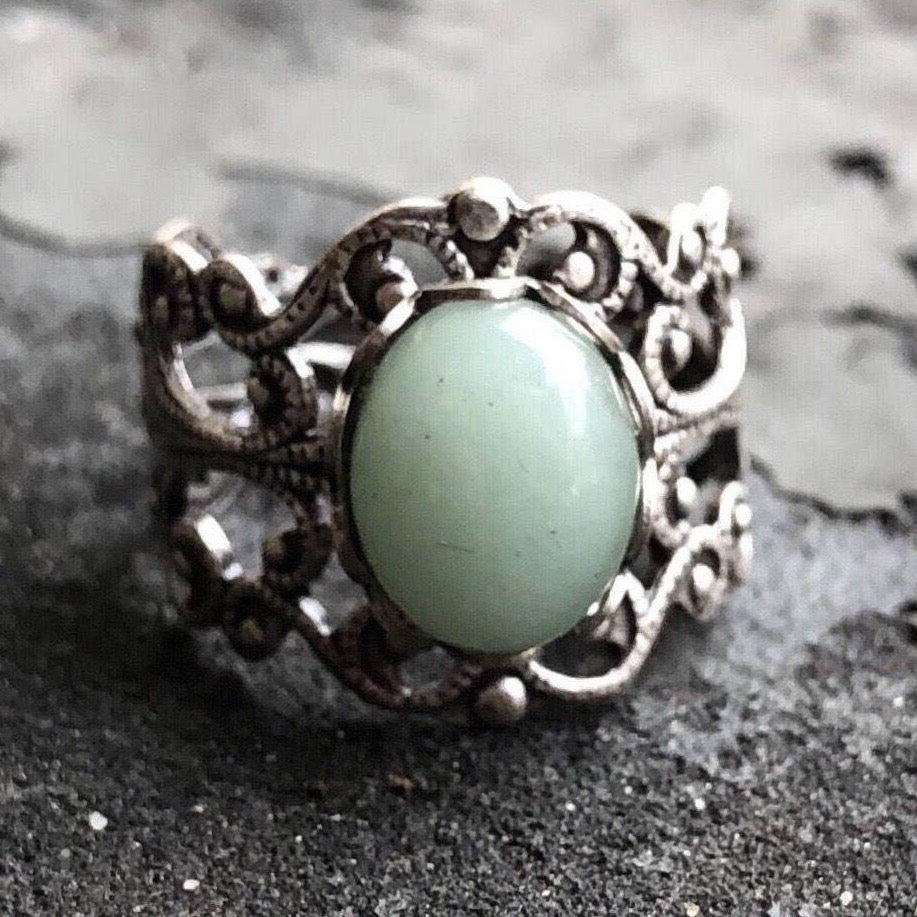 Antiqued brass modern vintage inspired adjustable filigree cocktail ring with a green aventurine semi-precious stone in the pastel goth style.