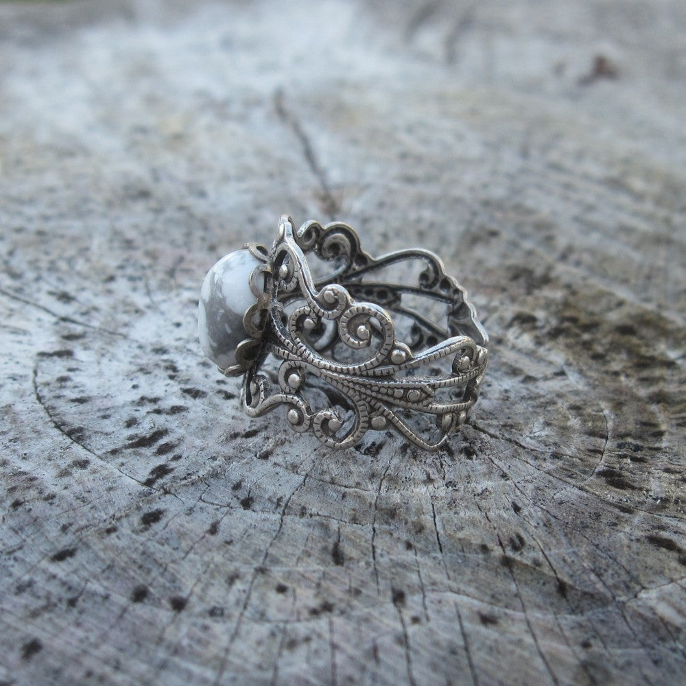 rich bronze colored antiqued brass modern vintage inspired adjustable filigree ring with a white marble howlite semi-precious mineral oval stone in the soft girl aesthetic