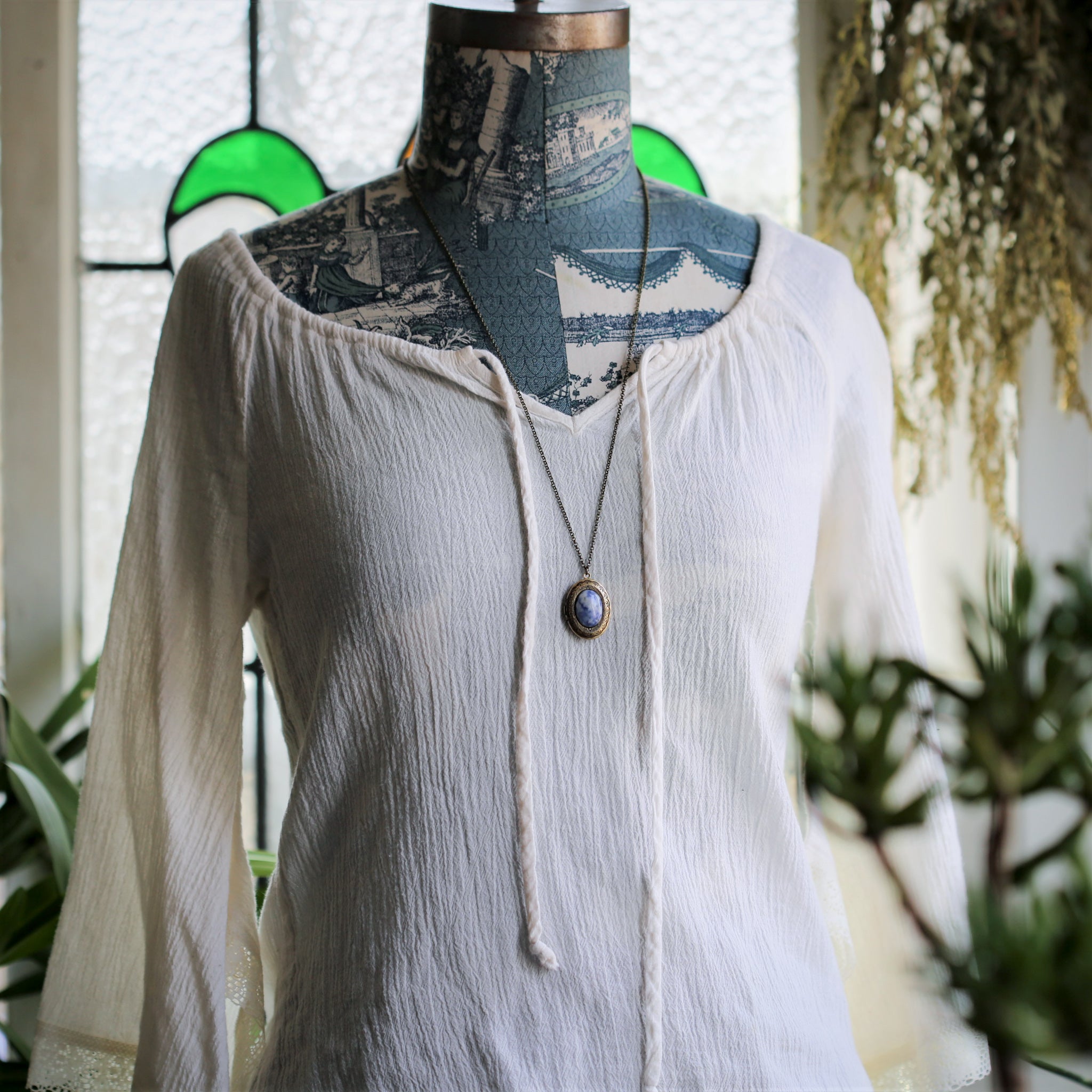 antiqued brass vintage style blue semi-precious mineral oval stone lockets in boho style