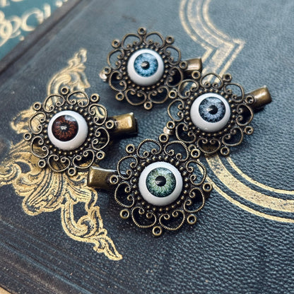 antiqued brass filigree green brown and blue eyeball hair clips in dethreal style