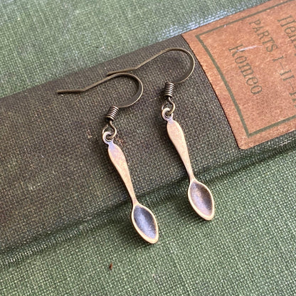 A pair of brass teaspoon dangle earrings.