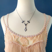 Antiqued vintage style dragonfly filigree teardrop necklace with antique ceramic rose cameo.
