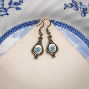Antiqued brass retro style tear drop earrings with vintage blue rose porcelain cameos