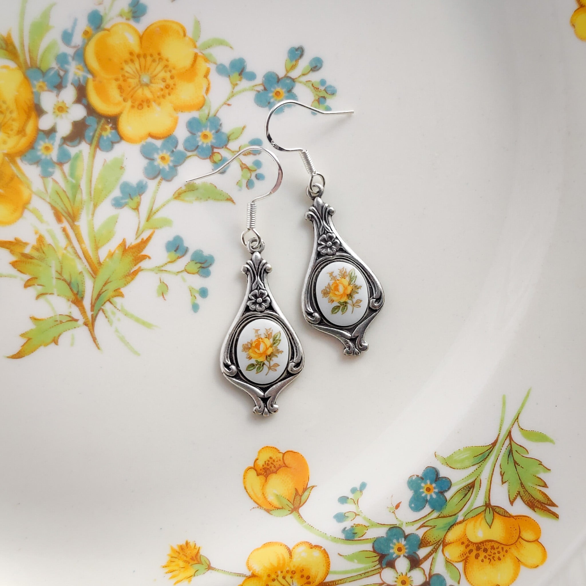 Antiqued silver retro style tear drop earrings with vintage yellow rose porcelain cameos