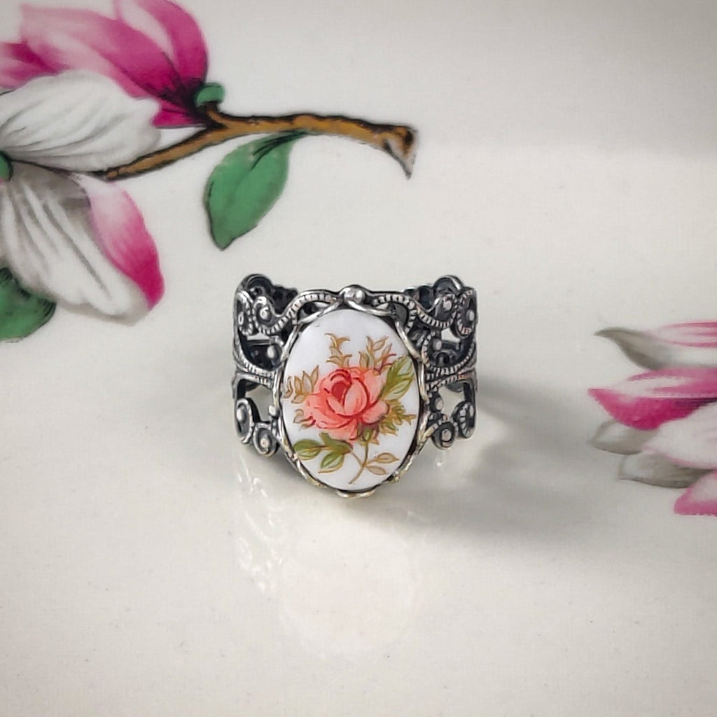 Antiqued silver vintage style filigree adjustable ring with an antique rose porcelain cameo