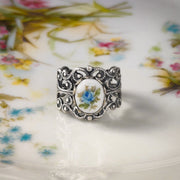 Antiqued silver vintage style adjustable filigree ring with an antique blue rose porcelain cameo.
