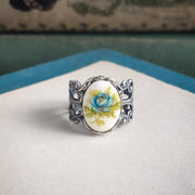 Antiqued silver adjustable filigree ring with an antique blue rose porcelain cameo