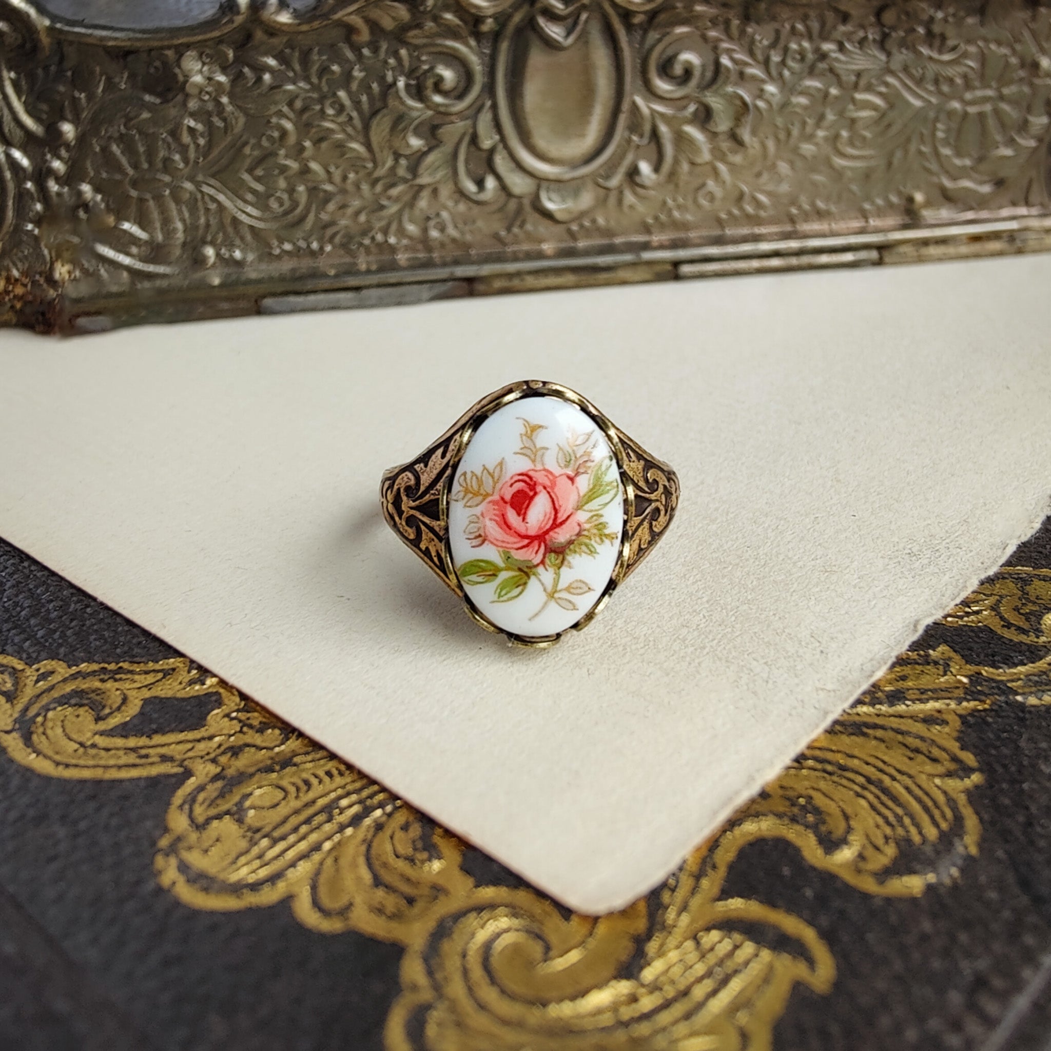 Antiqued brass vintage style adjustable ring with a porcelain vintage pink rose cameo