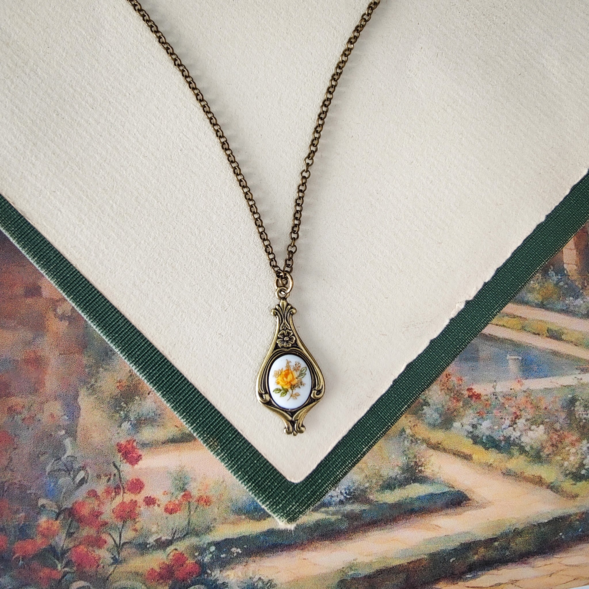 Antiqued retro-style drop necklace with vintage porcelain rose cameo