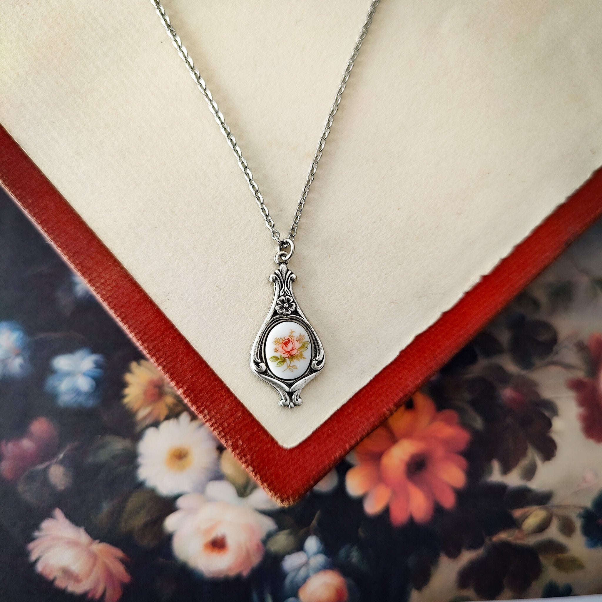 Antiqued retro-style drop necklace with vintage porcelain rose cameo