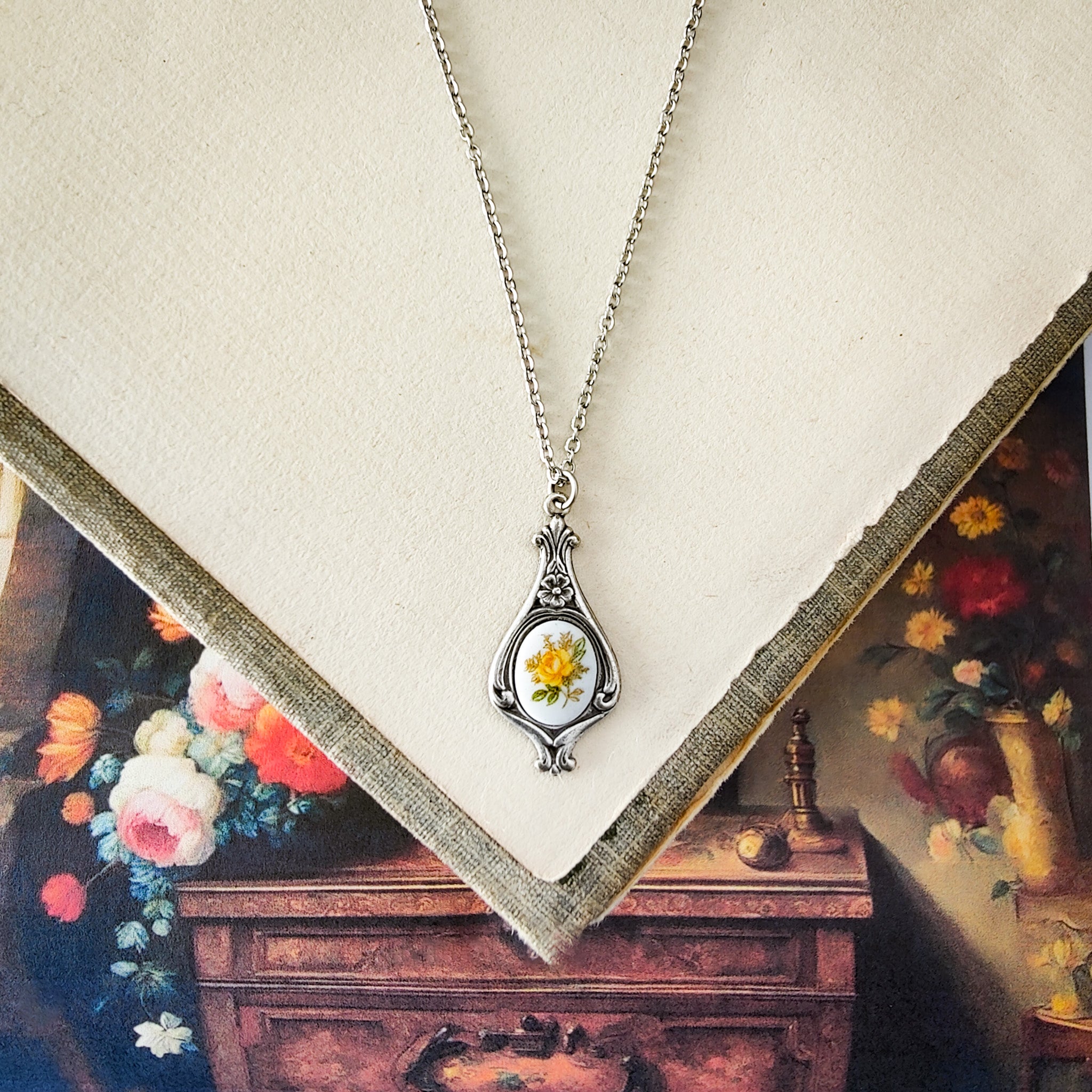 Antiqued retro-style drop necklace with vintage porcelain rose cameo