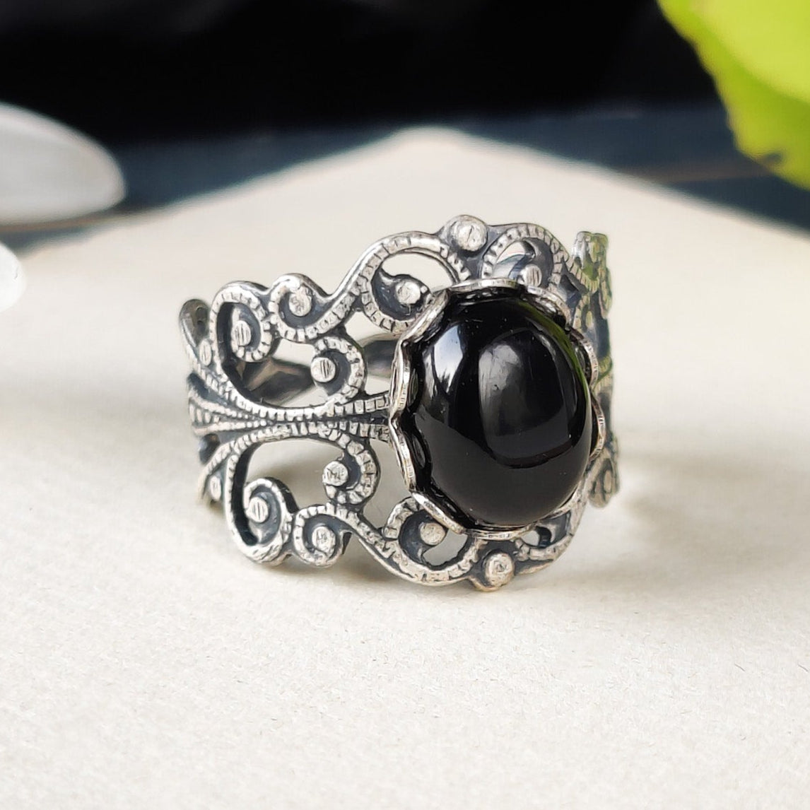 Antiqued silver modern vintage inspired adjustable filigree statement ring with a black oval onyx semi-precious stone mineral cabochon in dark fantasy style