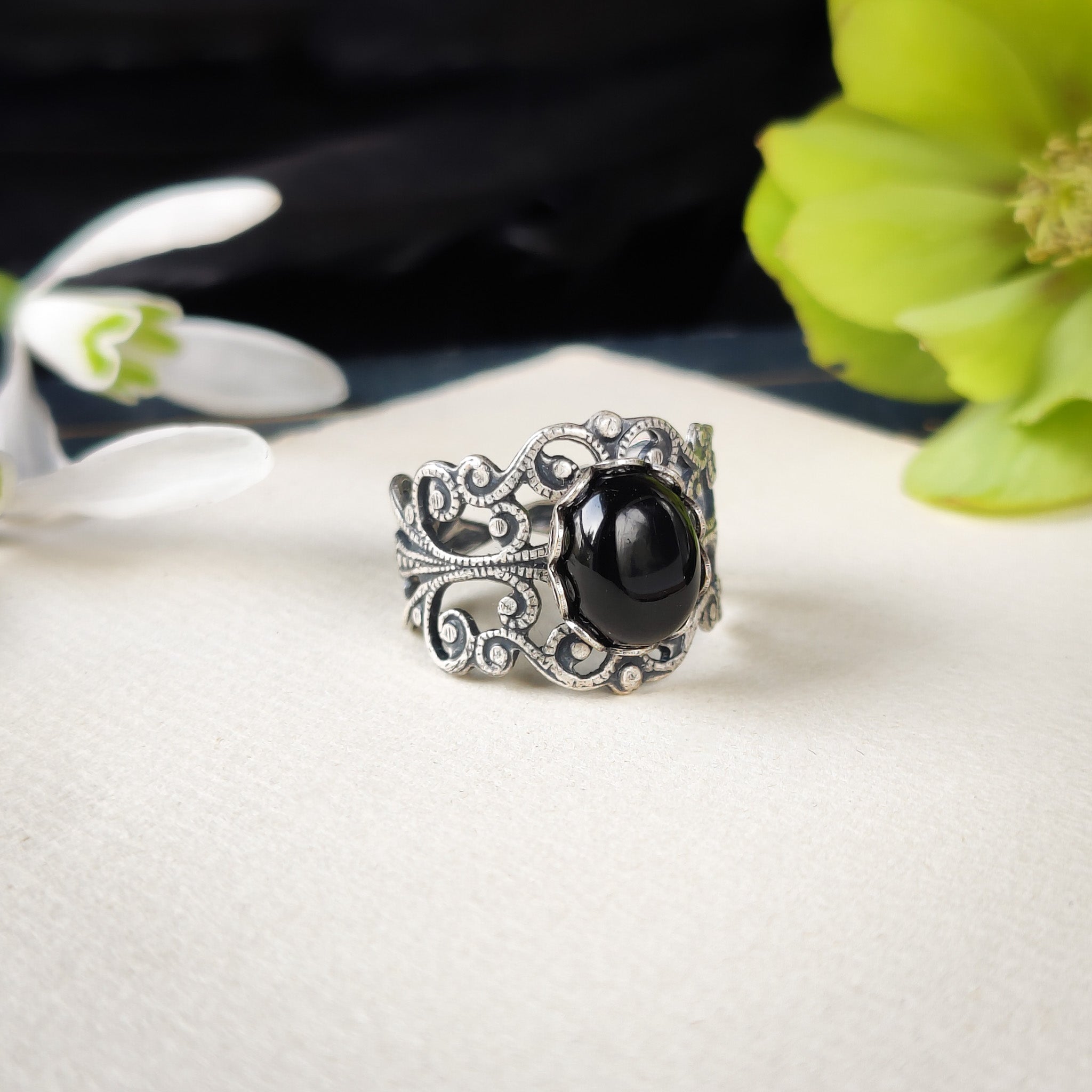 Antiqued silver modern vintage inspired adjustable filigree statement ring with a black oval onyx semi-precious stone mineral cabochon in dark fantasy style