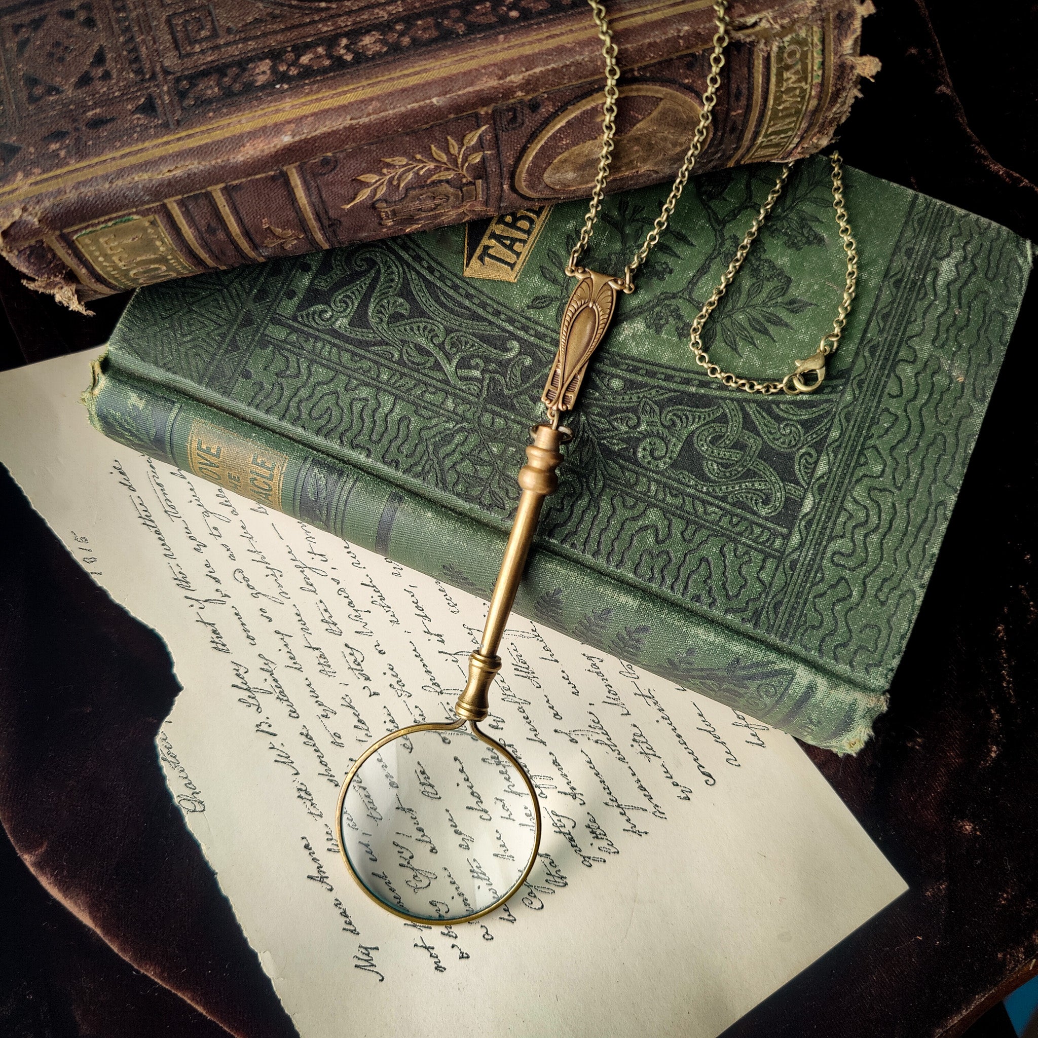 Antiqued brass vintage style long magnifying glass necklace with an art deco chain with 5xs magnification for women and men