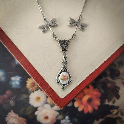 Antiqued vintage style dragonfly filigree teardrop necklace with antique ceramic rose cameo.