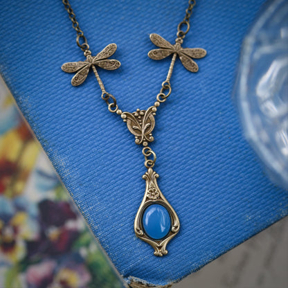 antiqued brass vintage-style dragonfly simple drop semi-precious stone mineral blue agate pendant in renaissance aesthetic