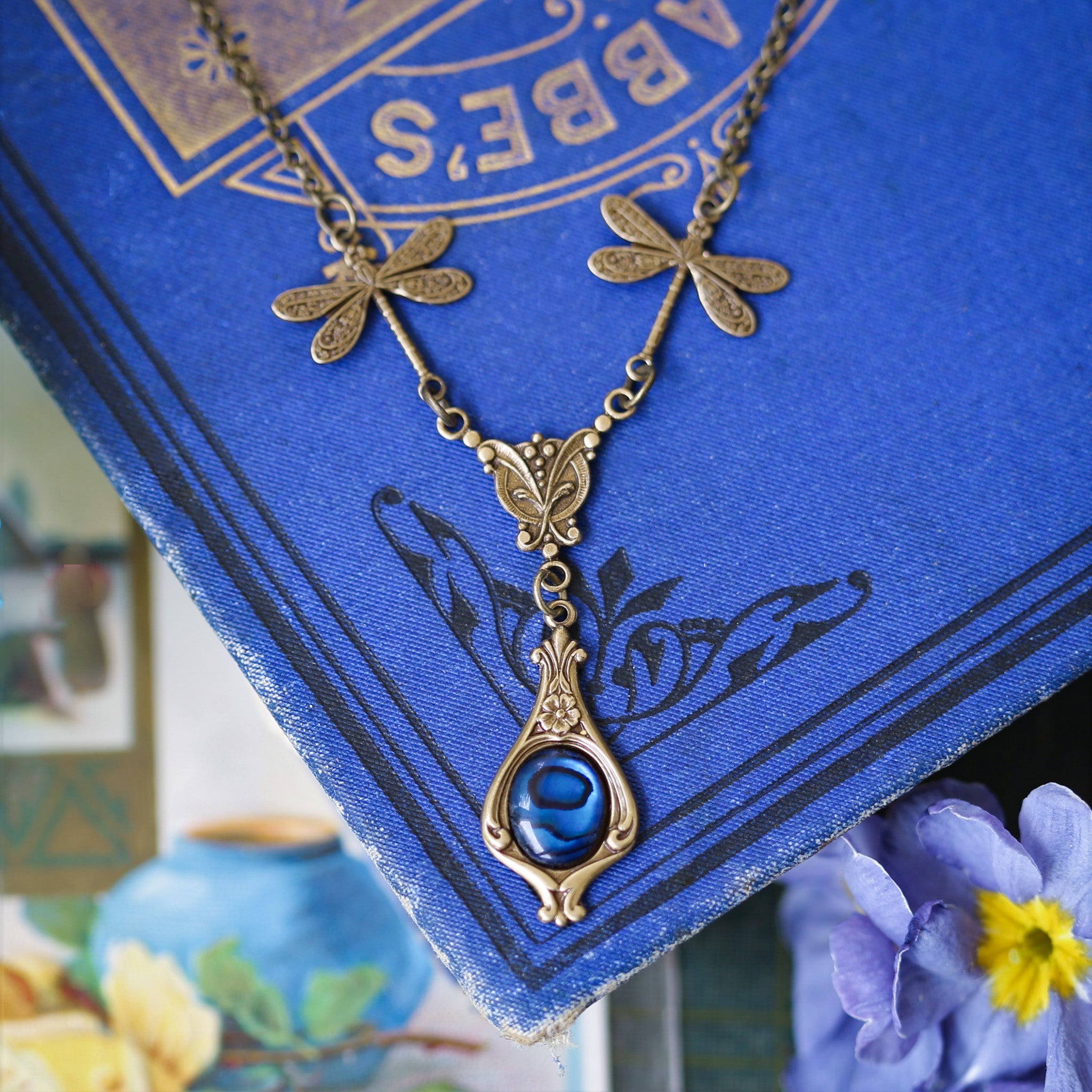 antiqued brass vintage-style dragonfly simple drop blue shell pendant in fairycore aesthetic